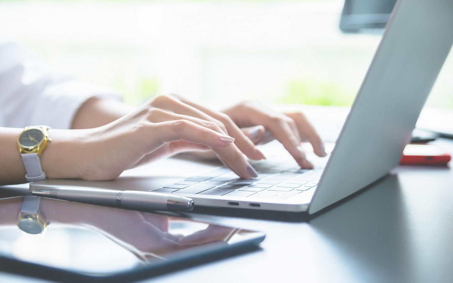 Professional reviewing financial charts and investment portfolio documents